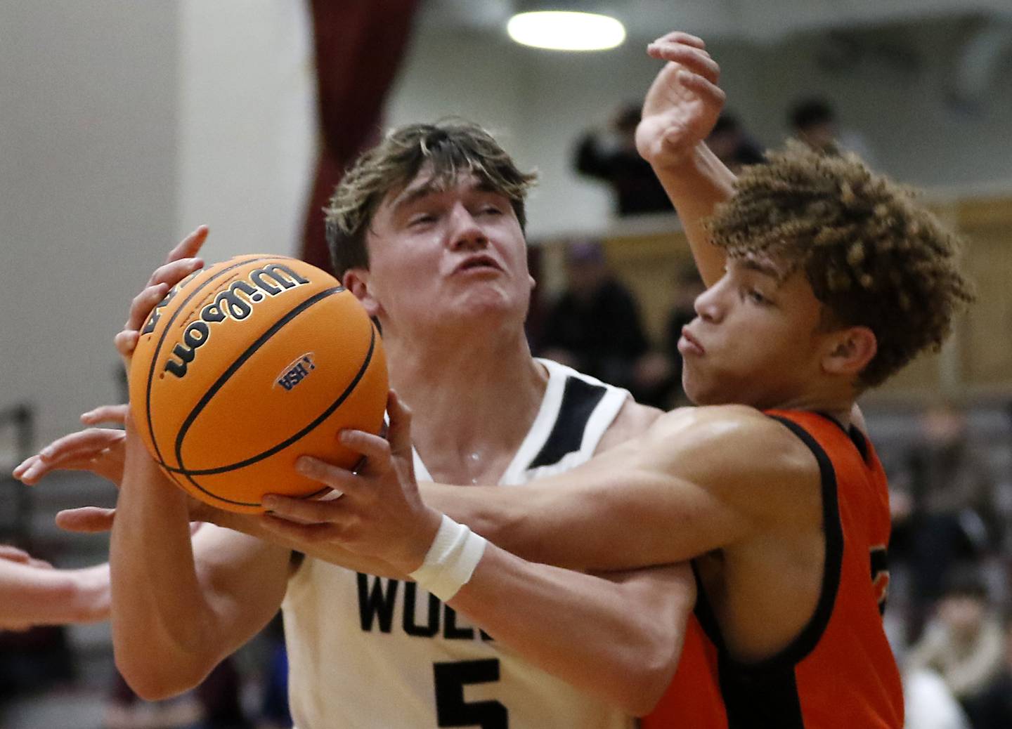 Prairie Ridge's Elijah Loeding drives to the basket against Crystal Lake Central's Avery Lee during an IHSA Class 3A Prairie Ridge Regional basketball game on Monday, Feb. 24, 2025, at Prairie Ridge High School.