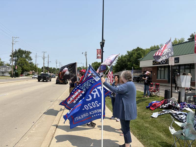 People rally outside the Trump and Truth Store in Huntley May 31, 2025.
