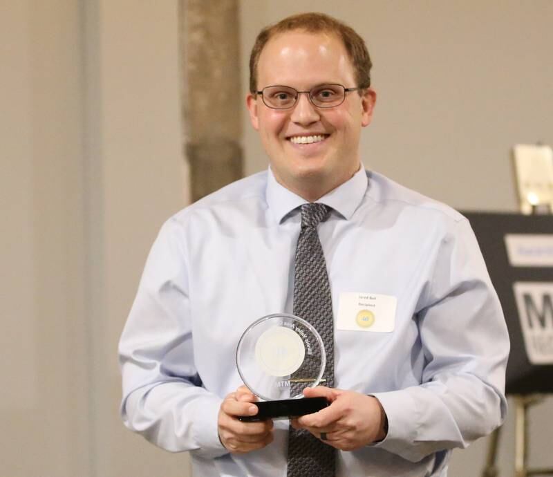 Jared Bell, Account Executive, Shaw Media poses for a photo with his award during the Illinois Valley Chamber of Commerce 40 Under Forty Awards Gala on Thursday, Feb. 9, 2023 at Westclox in Peru.