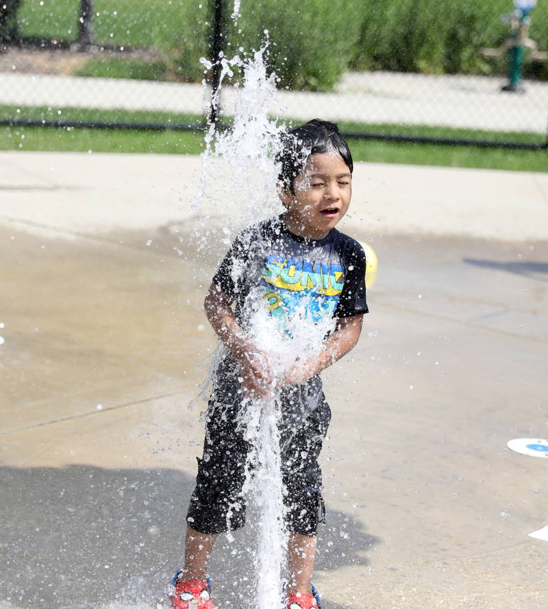 Angel Trujillo. 3, of Lyons plays in the water at the Gordon Park Splash Pad in La Grange as temperatures hit the 90s on Friday, July 28, 2023.