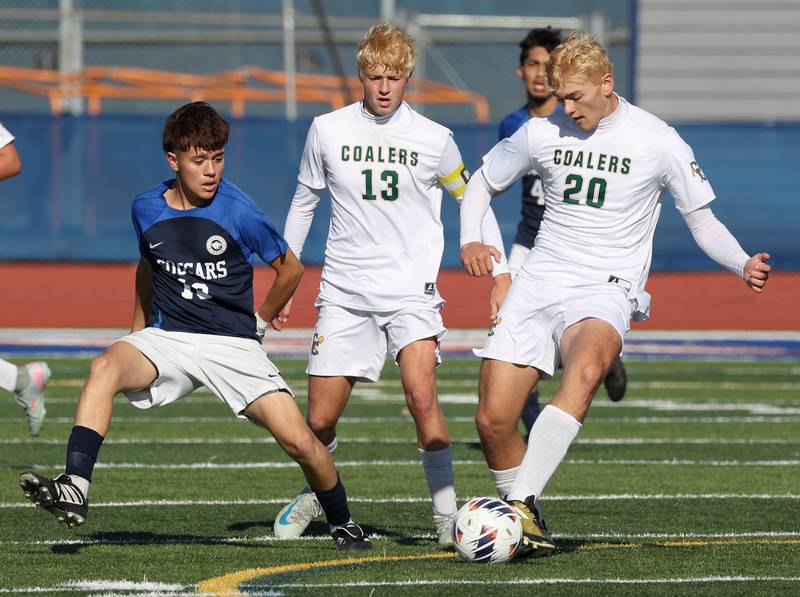 Coal City's Martin Ramirez keeps the ball away from Chicago Academy's Andrew Garcia Friday, Nov. 7, 2025, during their Class 1A state third place game at Hoffman Estates High School.