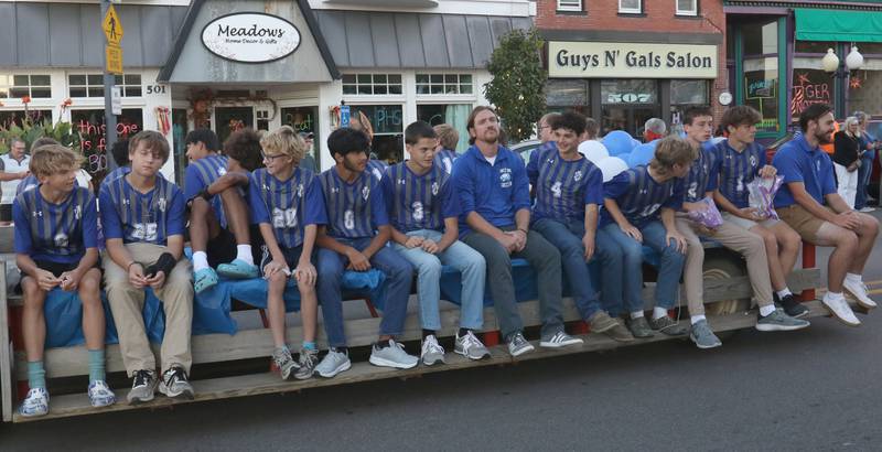 The Princeton High School boys soccer team rides during the homecoming parade on Thursday, Sept. 25, 2025 along South Main Street in Princeton .