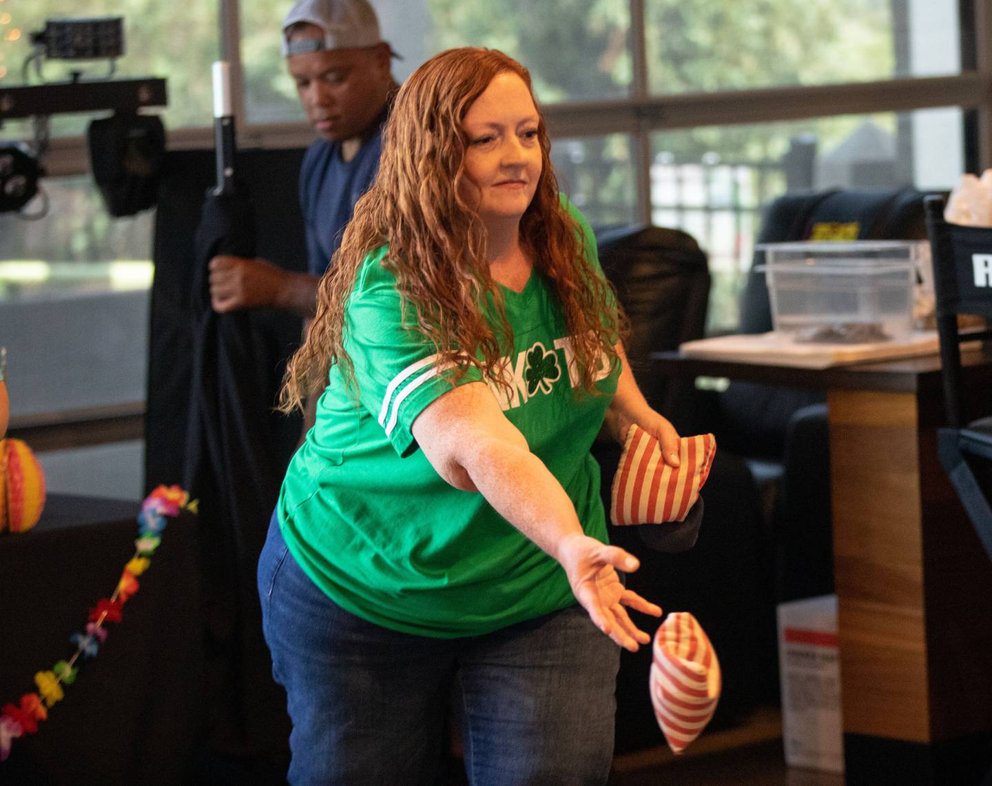 Kelly Carlson of Minneapolis, Minn. plays bags during the third anniversary of Wahlburgers in St. Charles on July 29, 2023.