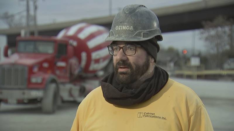 Jeff Hanus was working at a job site on Nov. 4 pouring concrete for the company Ozinga when a woman drove up to his truck parked near Interstate 55 in Bolingbrook. She exited her car, leaving two children inside, and approached Hanus. He performed the Heimlich maneuver on the woman. (ABC7 Chicago via AP)