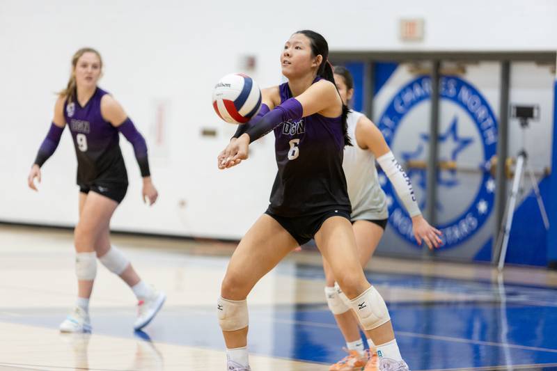 Downers Grove North's Nicole Liu returns a volley against St. Charles North on Thursday Oct. 23, 2025 in St. Charles.