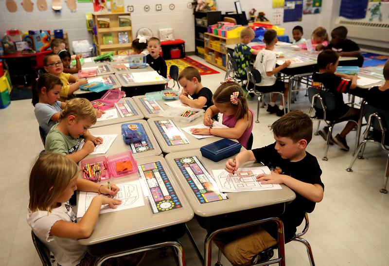 Second grade students work on making a book during the first day of school on Tuesday, Aug. 12, 2025, at District 300's Westfield Community School in Algonquin.