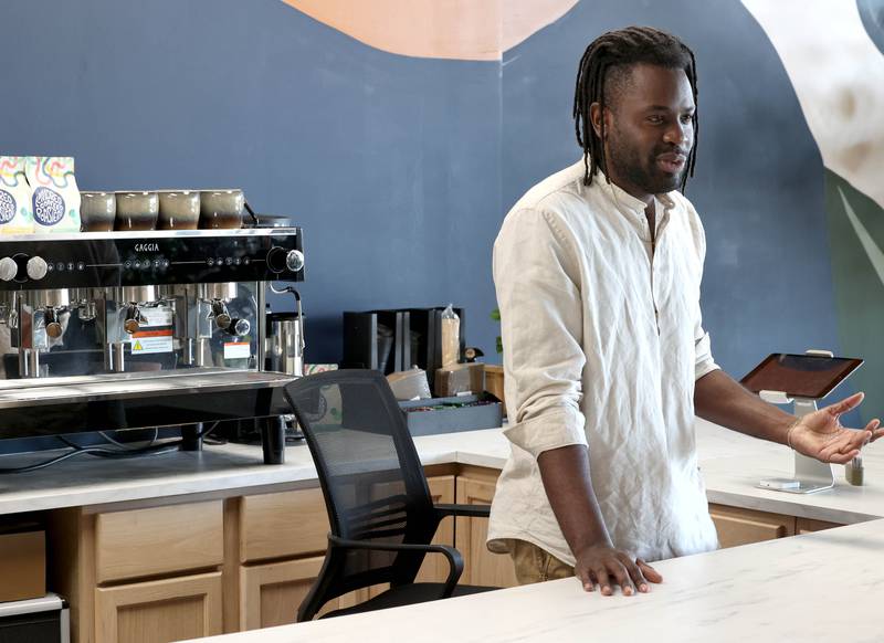 Troy Rorer, owner of The Greenhouse with his wife Kailey, talks Thursday, Feb. 29, 2024, about the new coffee bar at the store in Sycamore. The Greenhouse has expanded in size and will soon offer new services.