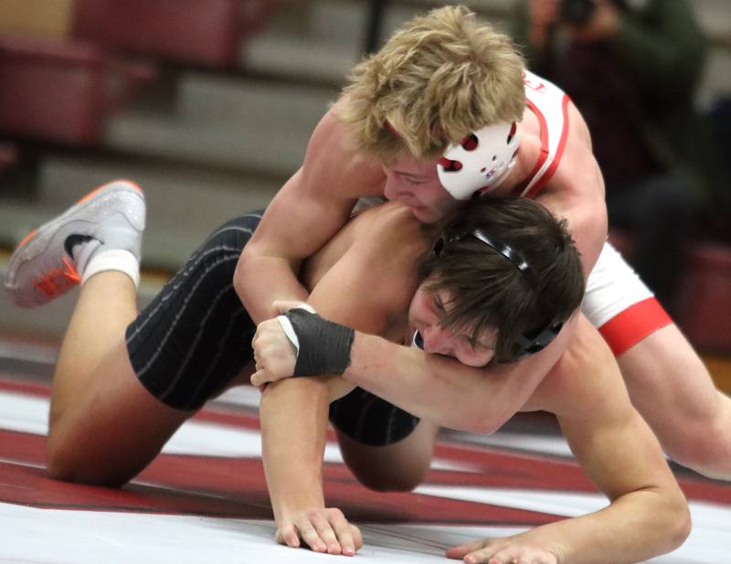 Huntley’s Radic Dvorak, top, battles Crystal Lake Central’s Dominic Vitale at 157 pounds in varsity wrestling on Friday, Dec. 13, 2024 at Huntley High School in Huntley.