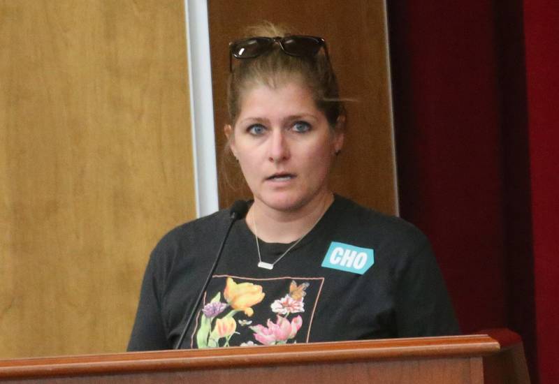 Janna Kinkin speaks to the Illinois Health Facilities and Services Review Board during a public hearing regarding OSF St. Elizabeth Hospital's plans to reduce services on Tuesday, June 10, at Central Intermediate School in Ottawa.