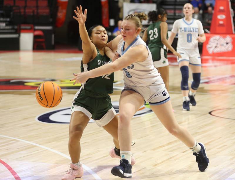 Cissna Park's Mady Marcott passes the ball around St. Edward's Madeline Sasis during the Class 1A third place game on Friday, March 7, 2025 at CEFCU Arena in Normal.