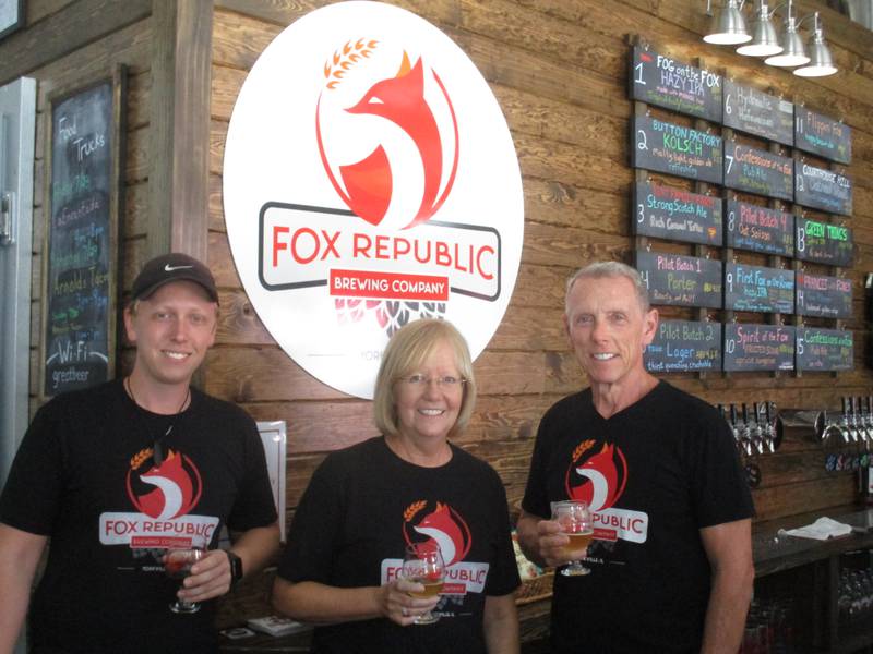 The Williams family is toasting the success of the new Fox Republic Brewing business in downtown Yorkville. They are, from left, Mike, Karin and Ed Williams, seen here on July 28, 2023.