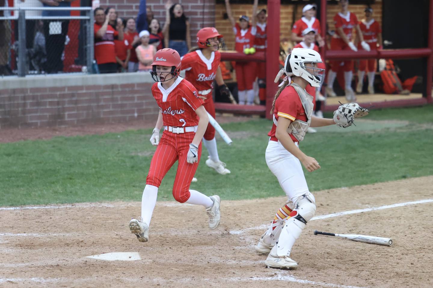 Bradley-Bourbonnais’ Bristol Schriefer scores to put the Boilermakers in the lead on the way to a 7-1 victory in 11 innings over Rock Island in the IHSA Class 4A Bradley-Bourbonnais Regional championship on Friday, May 30, 2025.