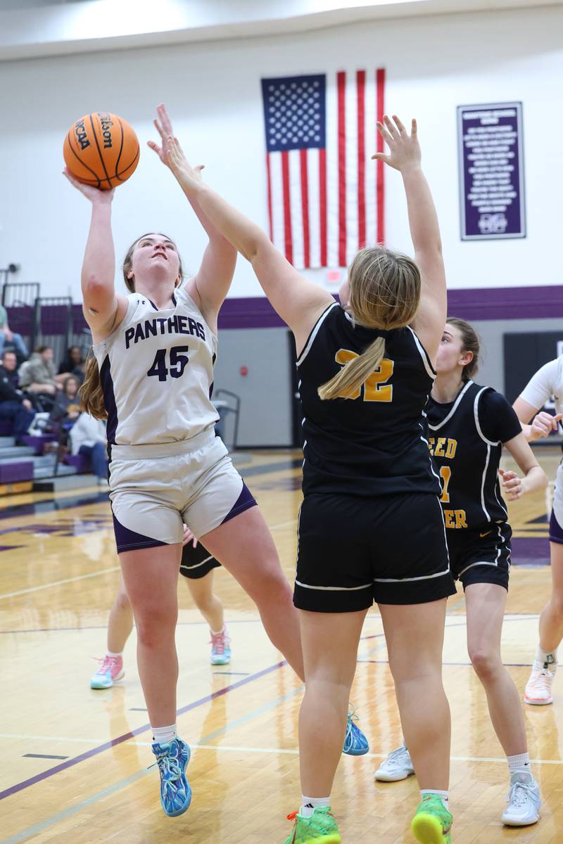 Manteno's Emily Horath shoots against Reed-Custer's Harlie Liebermann during Reed-Custer's 45-42 victory over Manteno on Monday, Feb. 2, 2026.