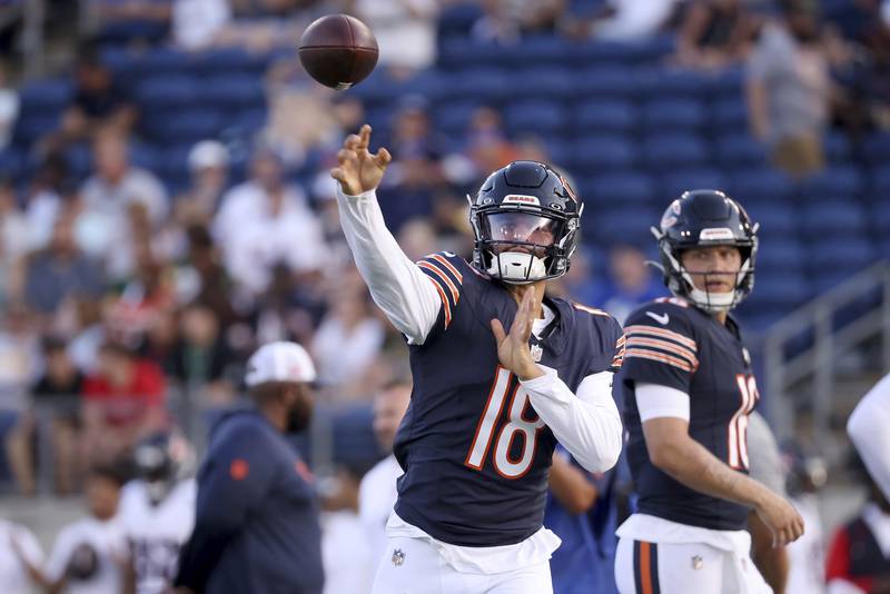 Chicago Bears quarterback Caleb Williams (18) warms up prior to the start of an NFL preseason football game against the Houston Texans, Thursday Aug. 21, 2024, in Canton, Ohio. (AP Photo/Kirk Irwin)