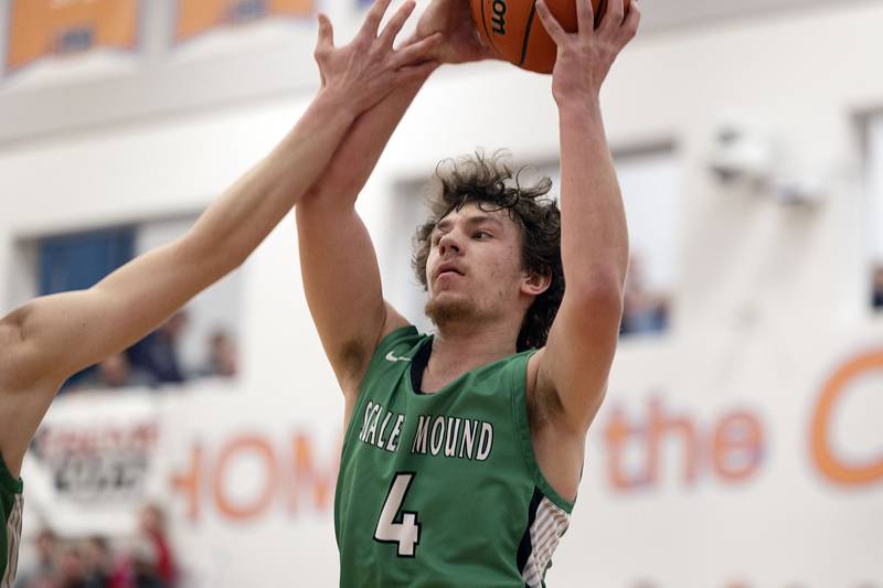 Scales Mound’s Jacob Duerr looks to pass against Fulton Friday, March 3, 2023 in the 1A sectional final in Lanark.