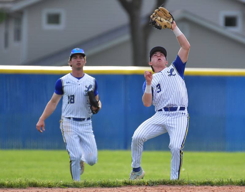 Lyons Township second baseman Lon Roberts catches a popup as right fielder Tommy Georgelos (18) backs him up during a game on May 18, 2026 at Lyons Township High School in LaGrange.