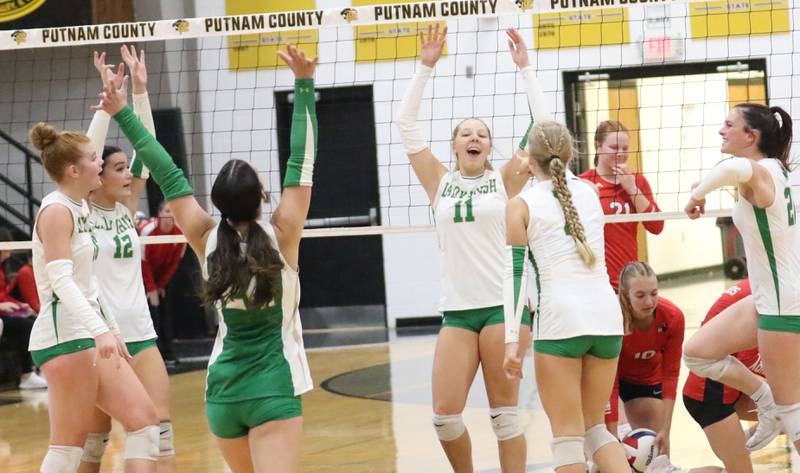 Members of the Seneca volleyball team react after scoring a point against Henry-Senachwine during the Tri-County Conference championship game on Thursday, Oct. 16, 2025 at Putnam County High School.
