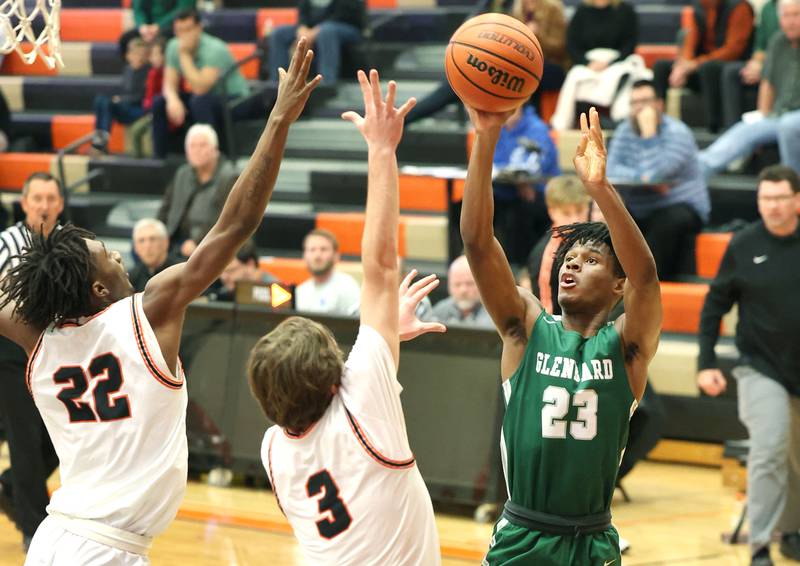 Glenbard West's Benji Zander shoots over DeKalb's Cooper Phelps during their game Tuesday, Nov. 29, 2022, at DeKalb High School.