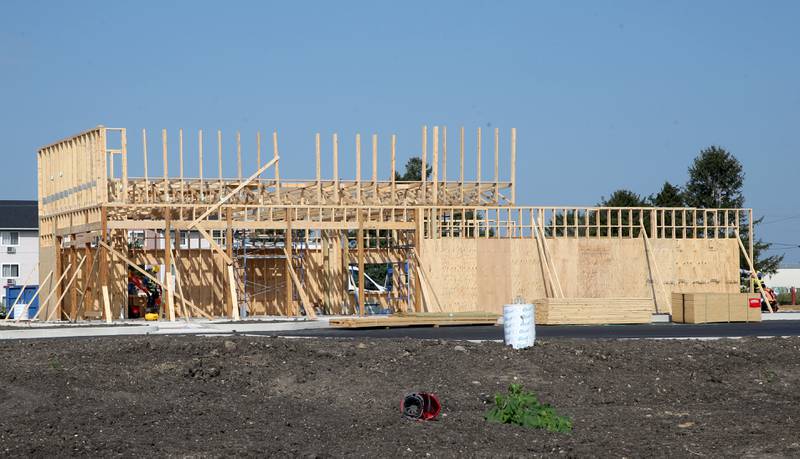 Crews begin on erecting the walls of the new Popeye's location next to Super 8 on Monday, Aug. 2024 in Peru.
