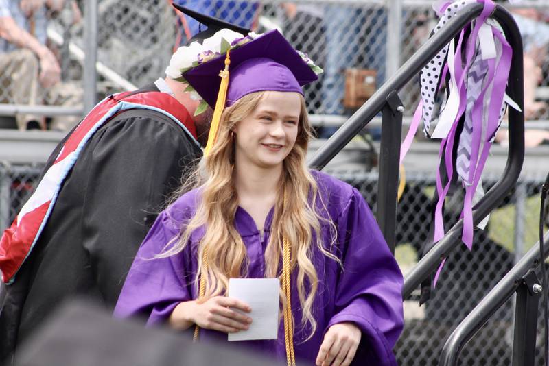 Veronica Wade, salutatorian, comes down the stairs after giving an address to the Class of 2023 during the Dixon High School graduation on Sunday, May 28, 2023.