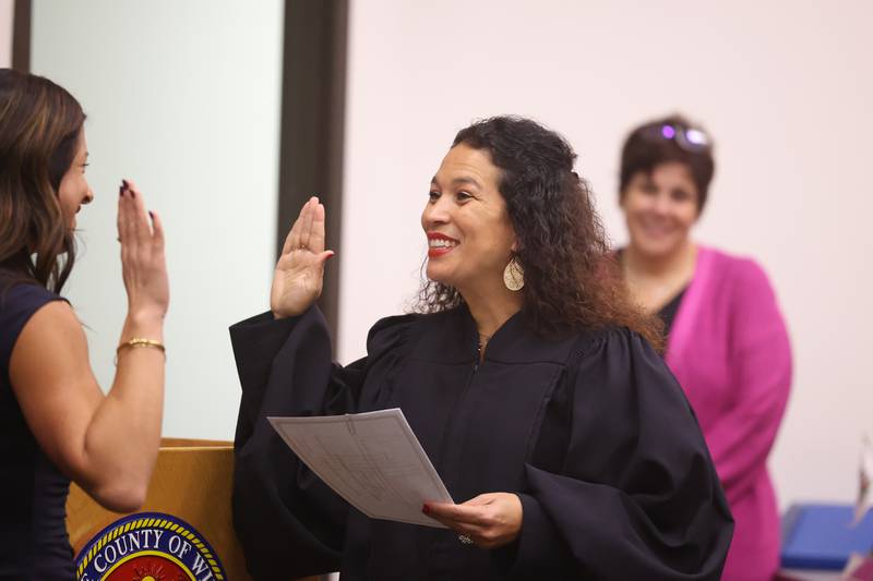 Judge Jessica Colon-Sayre swears in Will County Clerk Lauren Staley-Ferry at the Will County Building in Joliet on Thursday.