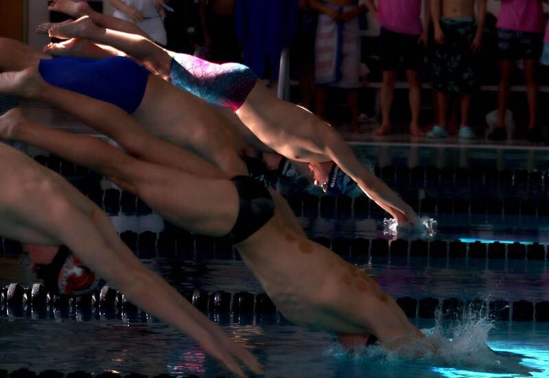 Jacobs’ co-op’s Max Chiappetta (top) begins the 500-Yard Freestyle during the Fox Valley Conference Swimming Championships at Woodstock North High School Saturday.