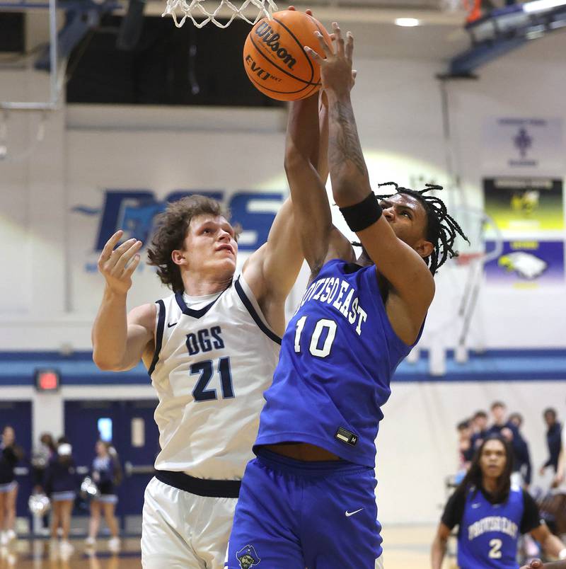 Downers Grove South's Daniel Laurich and Proviso East's Anthony Anderson go after a rebound during their game Friday, Feb. 14, 2025, at Downers Grove South High School.