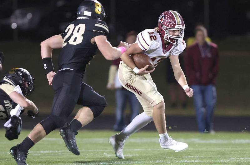 Morris' Carter Button looks to get by Sycamore's Ethan Bode during their game Friday, Oct. 21, 2022, at Sycamore High School.