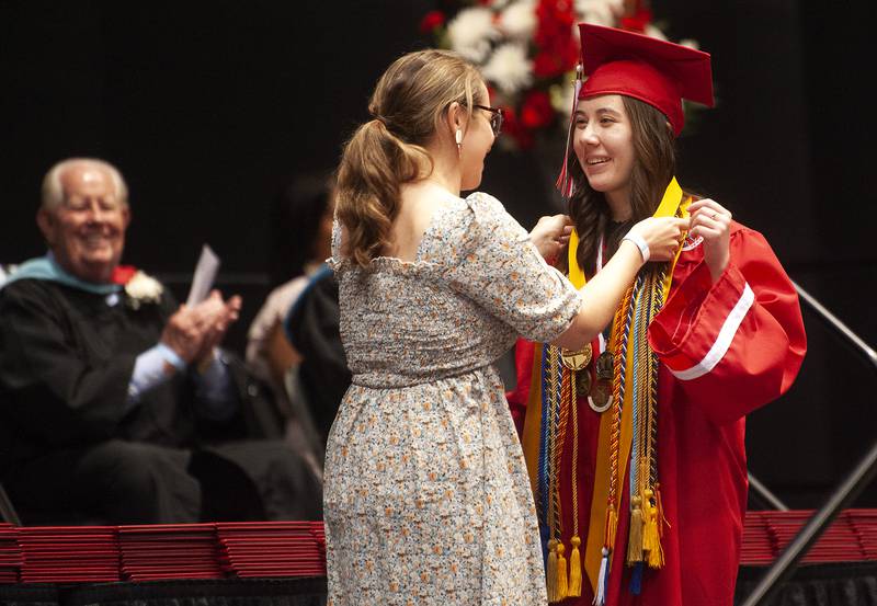 Valedictorian Sophia Jedziniak receives an award before addressing her fellow graduates during Yorkville High School's class of 2022 graduation ceremony at the NIU Convocation Center on Friday, May 20, 2022.