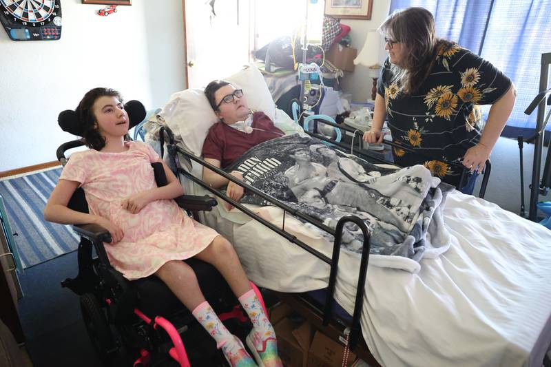 Sherry Pens, left, talks with her children Anthony and Alyssa Pens and her brother Anthony on Monday, March 11, 2024 in Coal City.