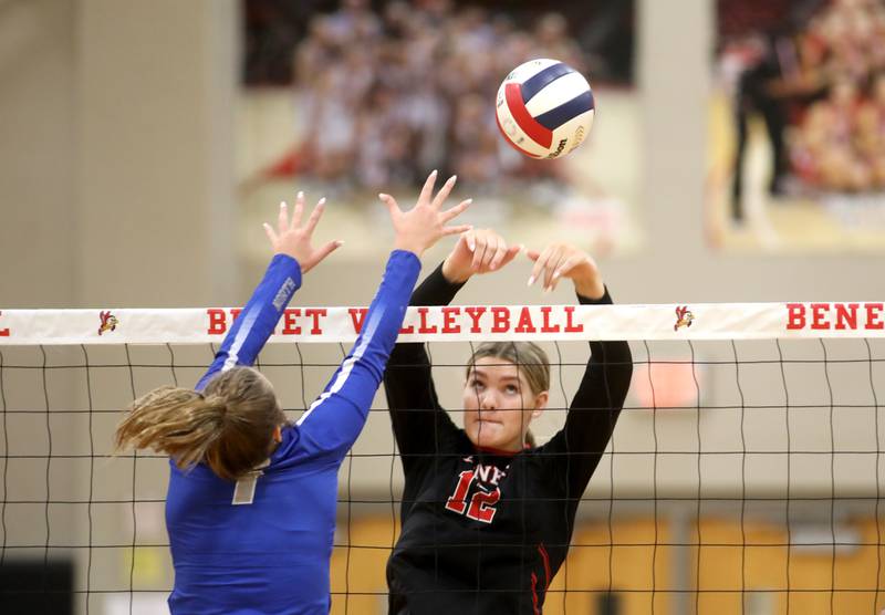 Benet’s Lynney Tarnow tips the ball over the net during a game against St. Charles North on Monday, Oct. 7, 2024 at Benet in Lisle.