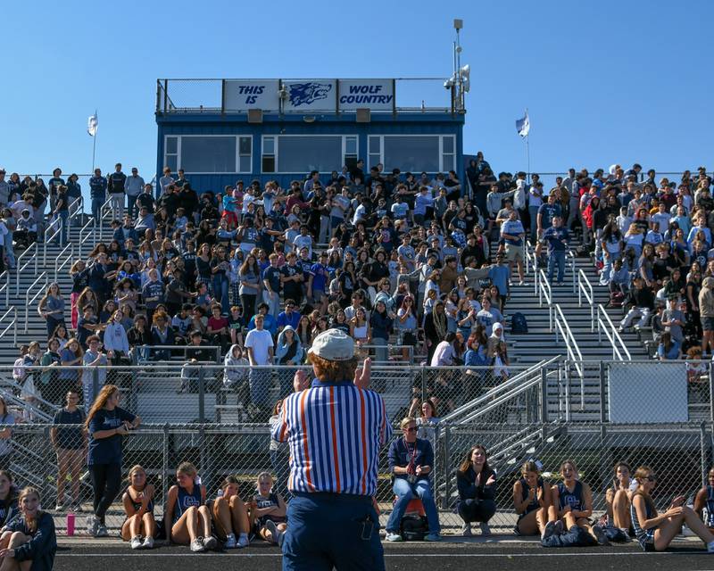 Brian Wismer has fun with Oswego East students on Friday Oct. 4, 2024, with Simon says before playing Simon says with 10 students from each class during the homecoming pep assembly held at Oswego East High School football stadium.