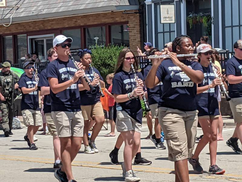 The Oswego East High School Band marched through downtown Oswego June 16 in the PrairieFest Parade.