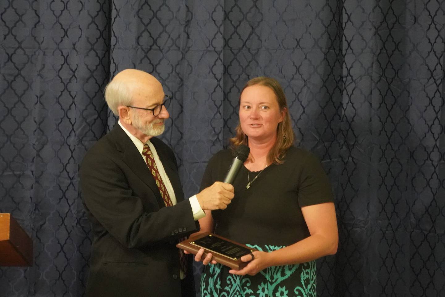 Kristy Eckardt received the Jane Etnyre Volunteer of the Year award at the Village of Progress Annual Banquet on Wednesday, Oct. 22, 2025 in Oregon. At left is Master of Ceremonies Tom Wadsworth.