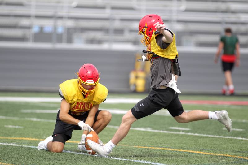 Batavia’s Patrick McNamara (right) kicks the ball during practice at the school on Thursday, Aug. 10, 2023.