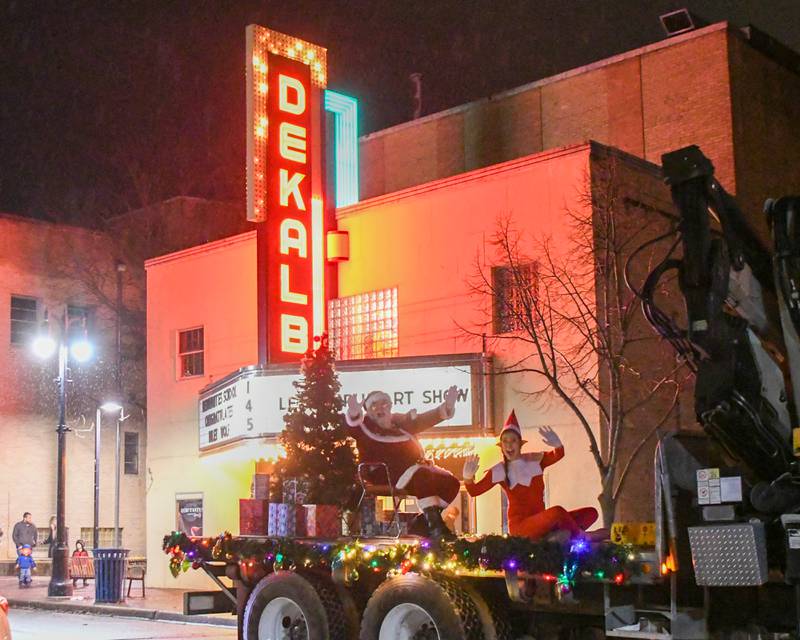 Santa Claus and one of his elves waves during the DeKalb Chamber of Commerce's annual Lights on Lincoln and Santa Comes to Town event held in downtown DeKalb on Thursday, Nov. 30, 2023.