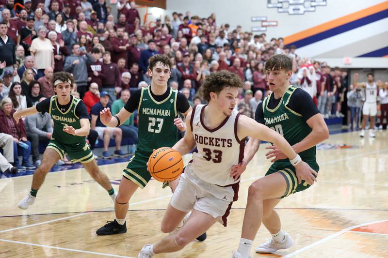 Bishop McNamara's Coen Demack, right, Karter Krutsinger (23) and Preston Payne, left, look to regain possession late in the fourth quarter during the Fightin' Irish's 77-70 loss to Tolono Unity in the IHSA Class 2A Pontiac Supersectional on Monday, March 9, 2026.