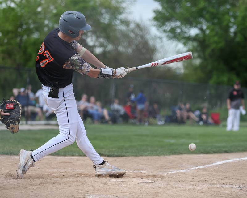 Sandwich's Chance Lange (27) hits a bouncer during baseball game between Sandwich at Plano.  May 8, 2024