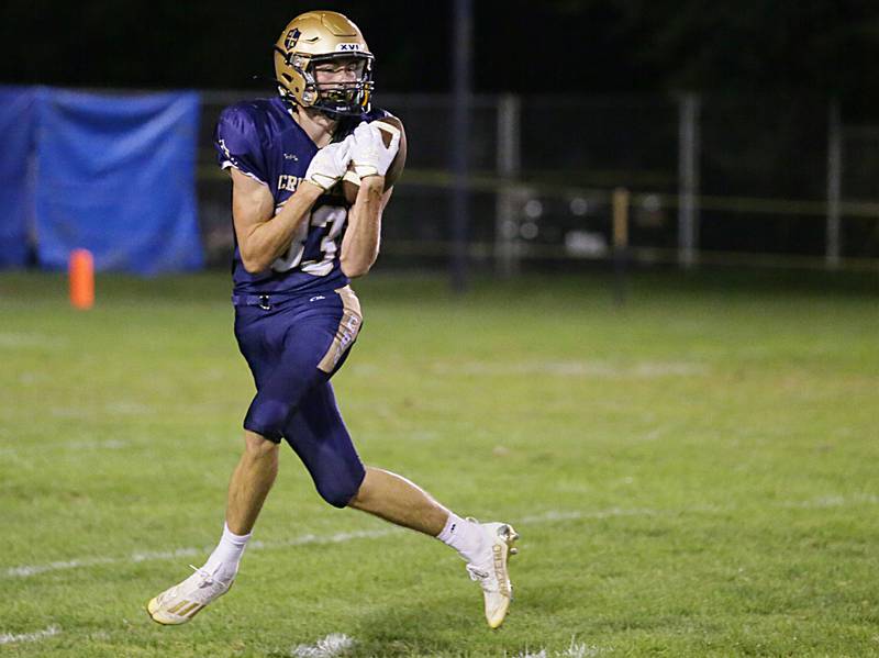 Marquette's Caden Eller makes a wide-open catch against Wethersfield on Friday, Sept. 16, 2022 at Gould Stadium in Ottawa.