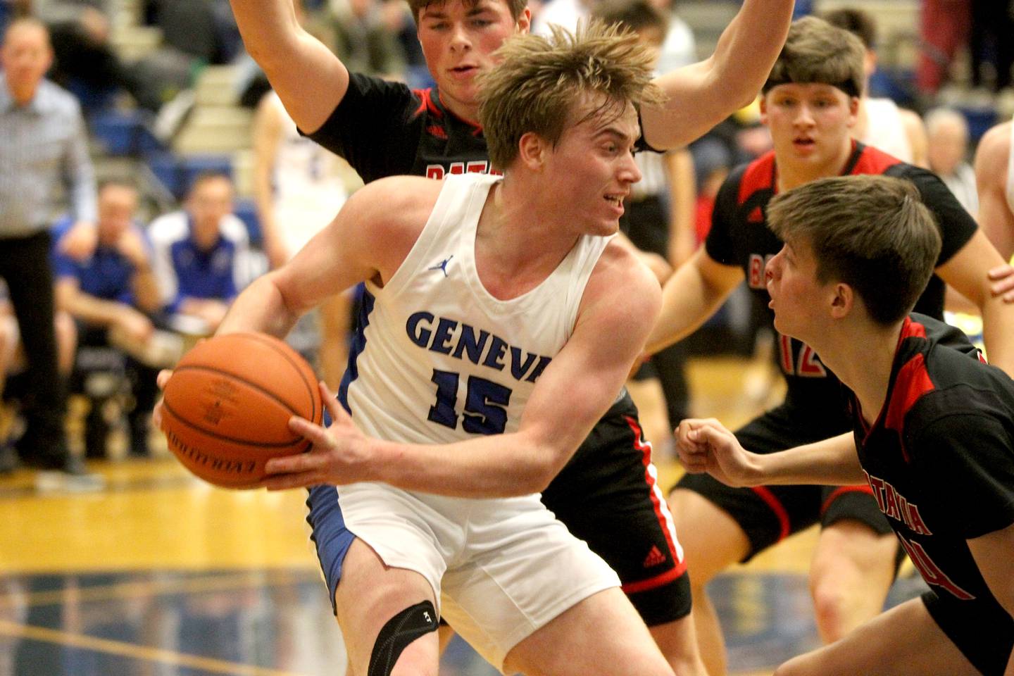 Geneva’s Jimmy Rasmussen looks to pass the ball from under the basket during a game against Batavia at Geneva on Friday, Feb. 3, 2023.