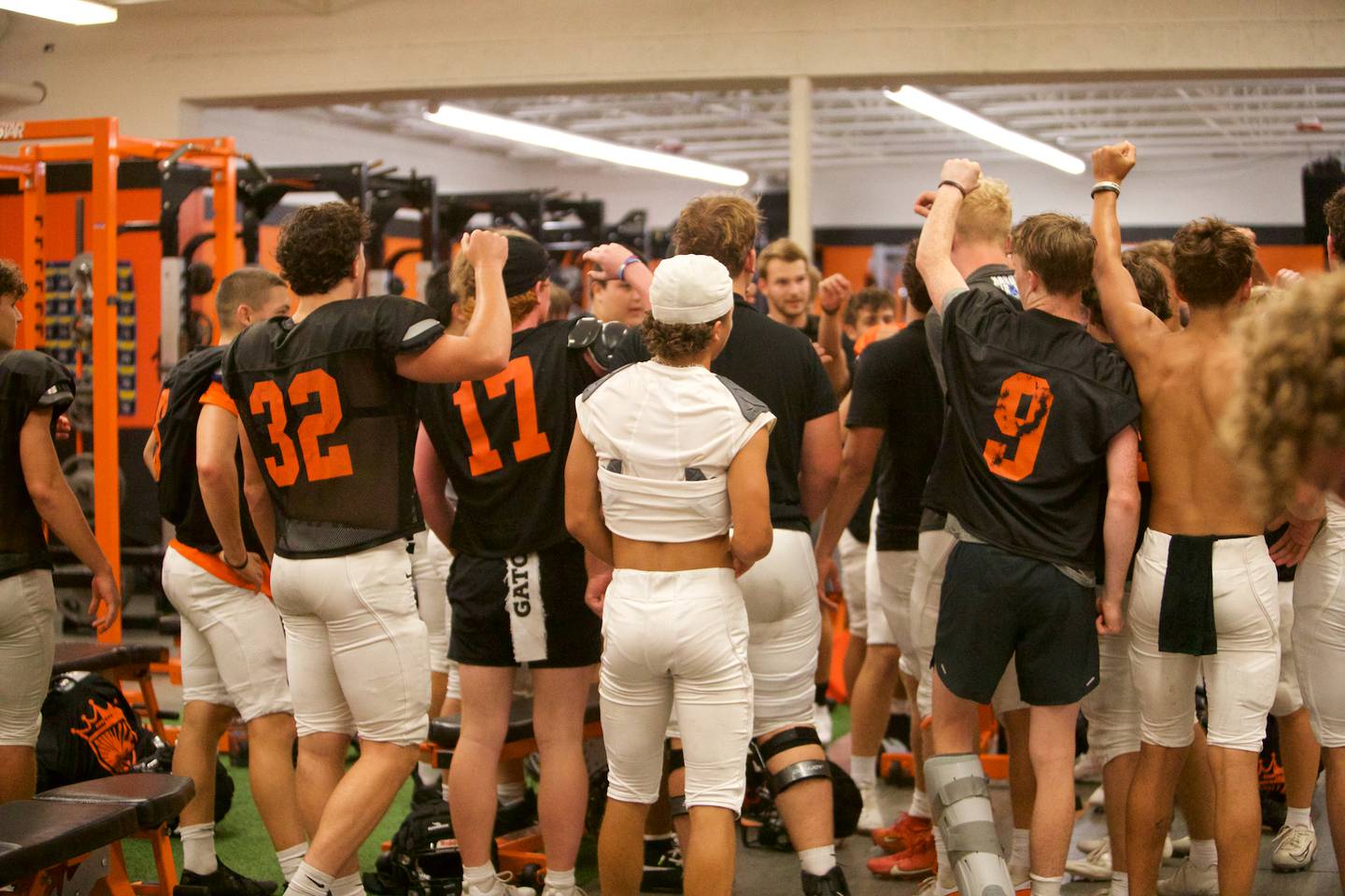 St Charles East's Varsity Football practice  huddles up in the weight room as they were  forced inside due to severe weather on Monday, Aug.18,2025 in St. Charles.