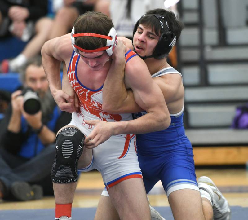 Oregon's Seth Stevens tries to escape a hold by Princeton's Augie Christiansen in the championship place match at 145 pounds at the 1A Polo Wrestling Regional held at Eastland High School on Saturday, Feb. 4.