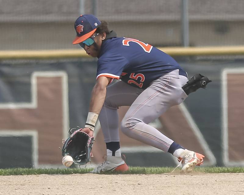 Oswego's Kam Jenkins (25) fields a hit to short during Class 4A Plainfield North Regional final baseball game between Oswego at Plainfield North. Saturday, May 31, 2025 in Plainfield.