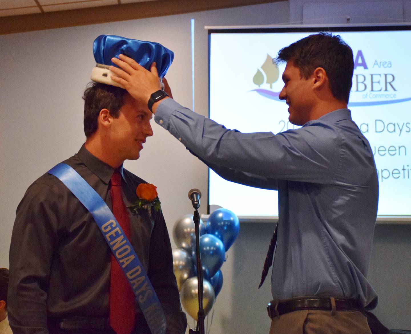 Owen Simmons, left, is crowned 2021 Genoa Days King by last year's king, Evan Skarzynski.