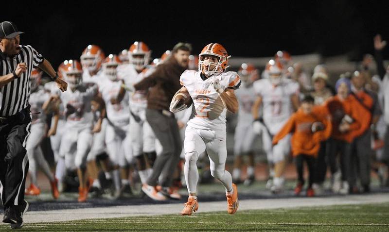 Hersey's Ryan Stearns runs a kickoff back for a touchdown in the first quarter in a football game against Prospect in Mount Prospect on Friday, September 23, 2022.