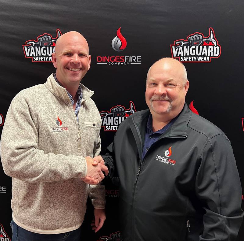Dinges Fire Company CEO Nick Dinges (left) welcomes Tim Salo, a fire apparatus specialist, to the Dinges team.