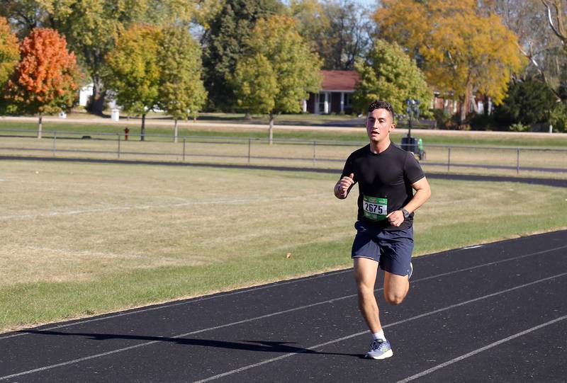 Race winner Carlos Heniziquez nears the finish line of the Sugar Grove Park District’s inaugural Run to Remember 5K & Fun Run on Saturday, Oct. 19, 2024 in Sugar Grove.