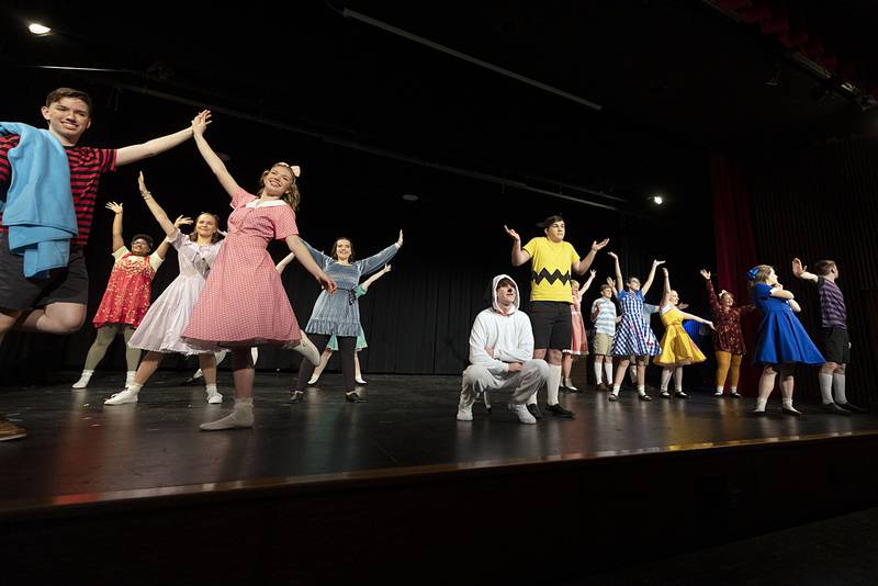 The cast of Newman High School rehearse a scene in their upcoming musical “You’re a Good Man Charlie Brown,” Tuesday, March 7, 2023. Performances will be March 9, 10 and 11 at 7 pm and March 12 at 2 pm at the Jerry Mathis Theatre at Sauk Valley College.