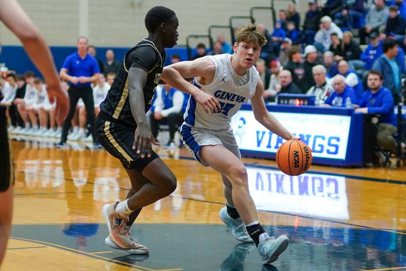 Geneva’s Hudson Kirby (25) drives to the basket against Glenbard North's Oturo Redento (2) during a class 4A Geneva Regional final basketball game at Geneva High School on Friday, Feb. 28, 2025.