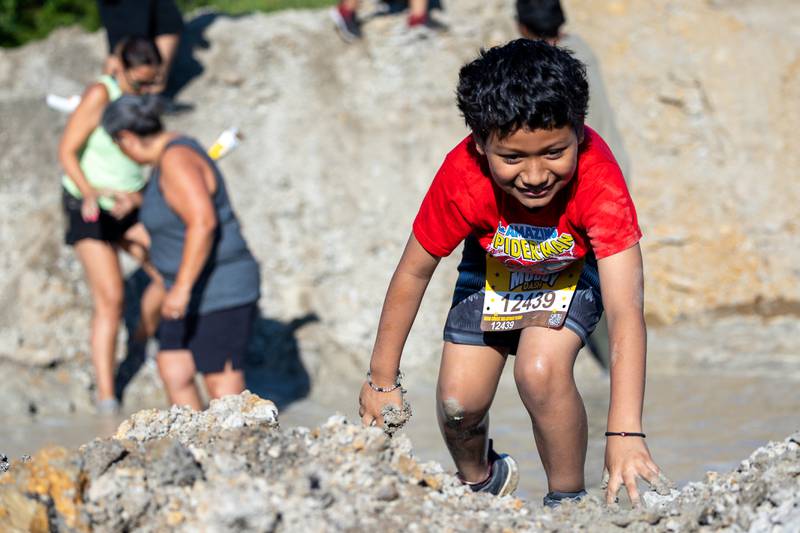 Jaiden Soberanis climbs out of mud hole at the 2025 Muddy Dash on Saturday, June 28, 2025 at Fox Valley Off Road in Utica.